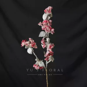 Artificial flowers with a Christmas atmosphere. Red and pink flowers with glittering powder on the surface. They will fall off. Be careful when photographing window flowers. - Begonia red with snowflakes and artificial snow on the surface